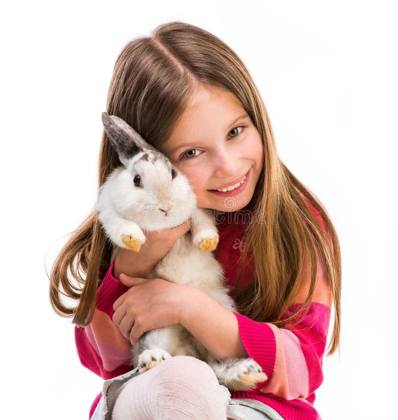 Muchacha linda con el conejo del bebé fotografía de archivo libre de regalías Muchacha linda con el conejo del bebé fotografía de archivo libre de regalías
