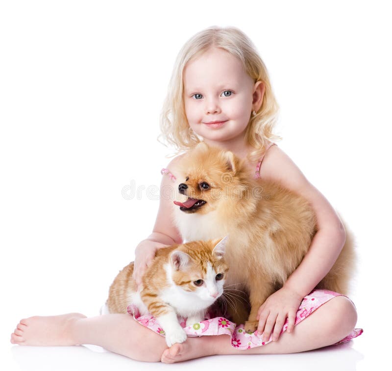 Girl playing with pets - dog and cat. looking away. isolated on. Girl playing with pets - dog and cat. looking away. isolated on