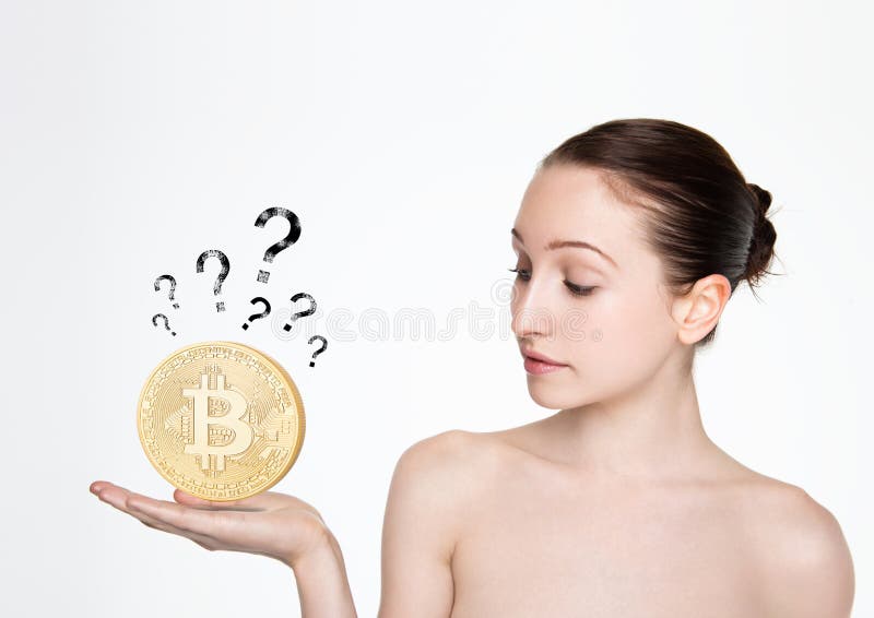 Muchacha que lleva a cabo el bitcoin en su mano con la pregunta imagen de archivo Muchacha que lleva a cabo el bitcoin en su mano con la pregunta imagen de archivo