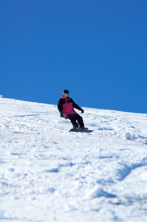 Muchacha rosada del Snowboard fotografía de archivo Muchacha rosada del Snowboard fotografía de archivo