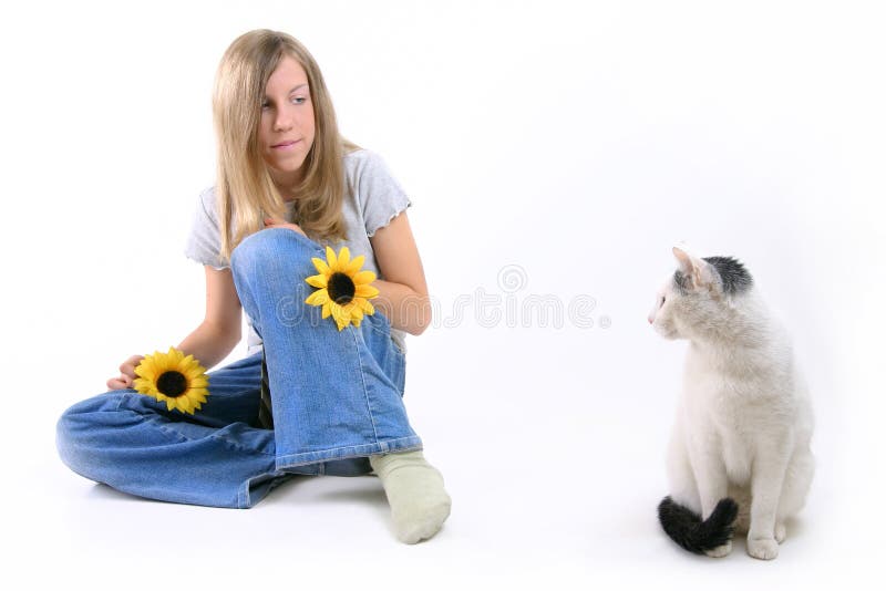 Young girl looking at her cat. Young girl looking at her cat.