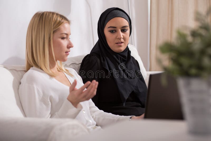 European and arab girls having a conversation. European and arab girls having a conversation