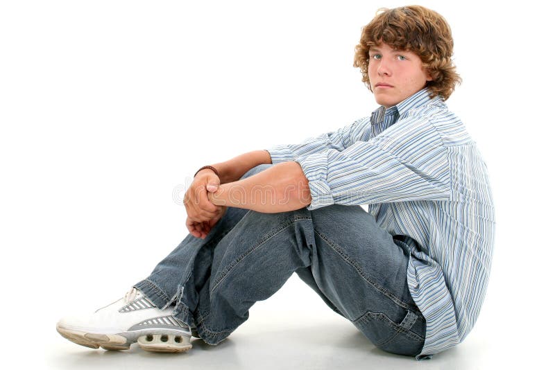 Attractive Sixteen Year Old Teen Boy In Casual Clothes Over White. Light brown curly hair and hazel eyes. Shot in studio with the Canon 20D. Attractive Sixteen Year Old Teen Boy In Casual Clothes Over White. Light brown curly hair and hazel eyes. Shot in studio with the Canon 20D.