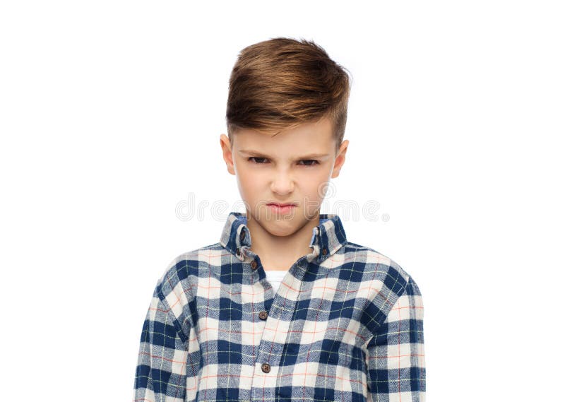 Muchacho enojado en camisa a cuadros imagen de archivo libre de regalías Muchacho enojado en camisa a cuadros imagen de archivo libre de regalías