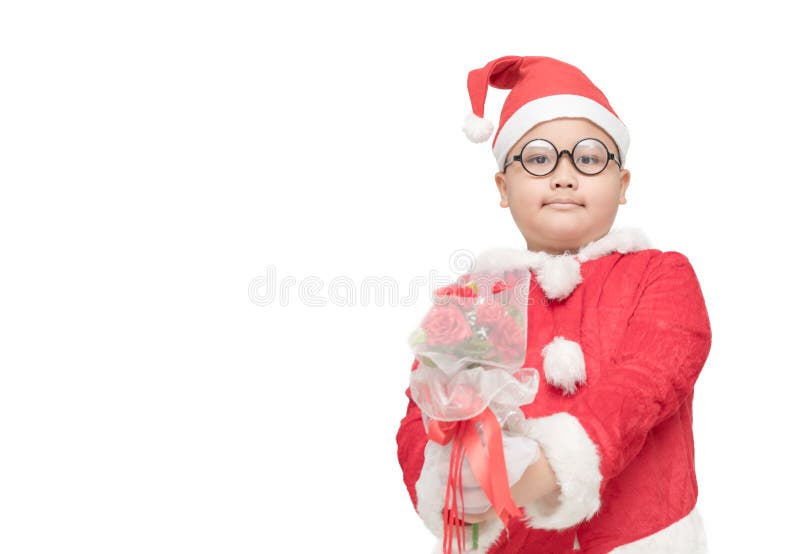 Muchacho obeso en ramo color de rosa de la tenencia del traje de Papá Noel fotos de archivo libres de regalías Muchacho obeso en ramo color de rosa de la tenencia del traje de Papá Noel fotos de archivo libres de regalías