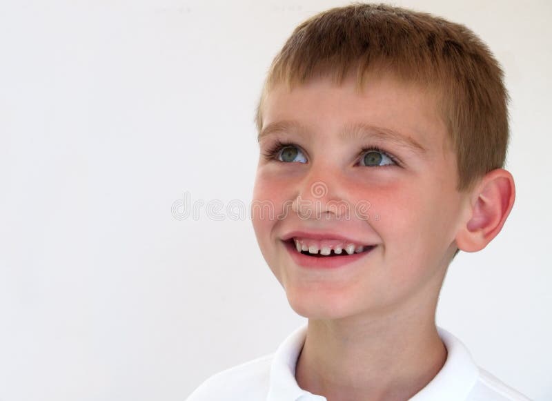 Smiling boy looking up. Smiling boy looking up