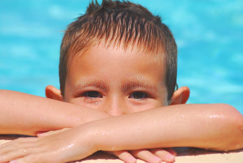 Boy swimming in a pool. Boy swimming in a pool