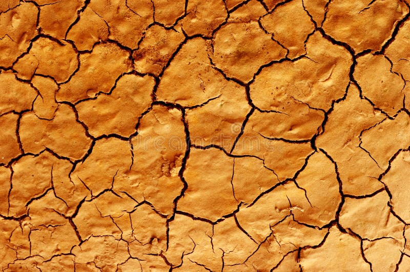 Cracked and dried mud dirt background texture in the desert. Cracked and dried mud dirt background texture in the desert