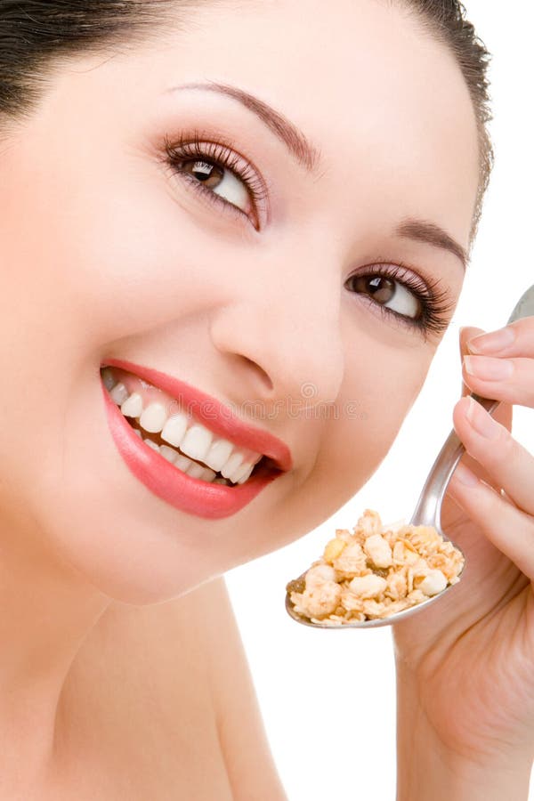 Muesli di cibo della giovane donna fotografia stock Muesli di cibo della giovane donna fotografia stock