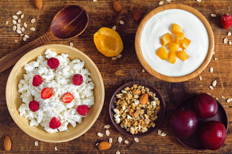 Muesli, yogurt, granola, fruits - healthy breakfast table set