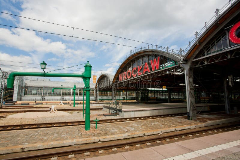 WROCLAW, POLAND: Sign of city Wroclaw over rails of Wroclaw Railway Station built in 1857 on May 19, 2014. Population of Wroclaw is 633,000, it is 4th largest city in Poland. WROCLAW, POLAND: Sign of city Wroclaw over rails of Wroclaw Railway Station built in 1857 on May 19, 2014. Population of Wroclaw is 633,000, it is 4th largest city in Poland