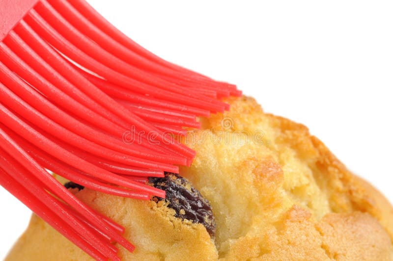 Muffin Being Brushed with Silicone Pastry Brush