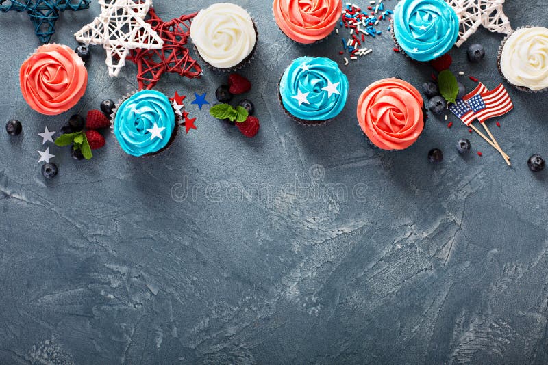 Red, blue and white cupcakes for the Fourth of July overhead shot with copy space. Red, blue and white cupcakes for the Fourth of July overhead shot with copy space