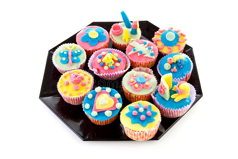 muffiner dekorerad platta royaltyfri fotografi muffiner dekorerad platta royaltyfri fotografi