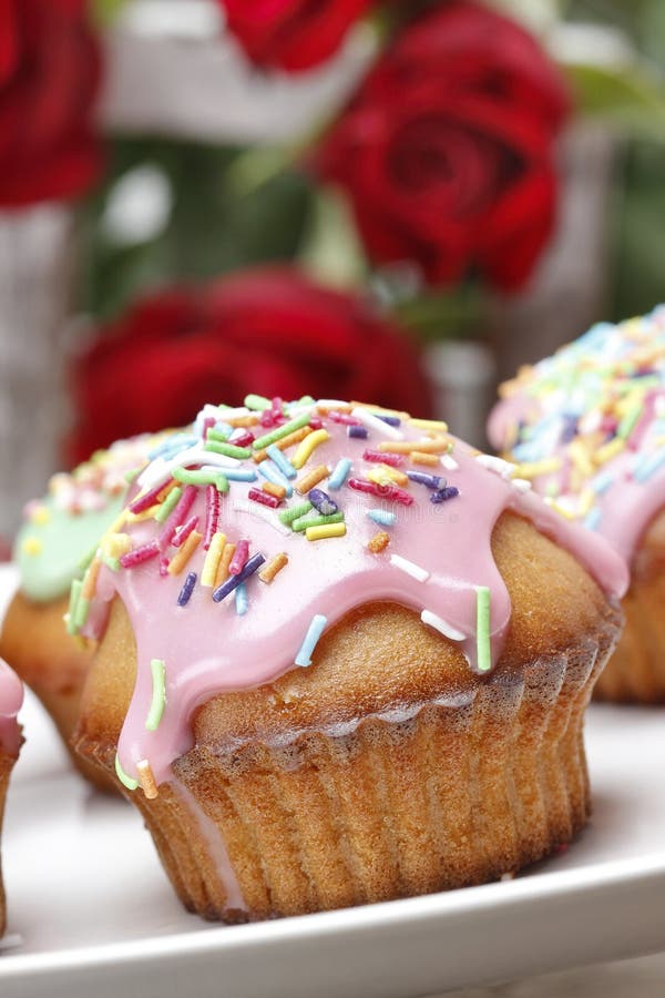 Muffins With Pink Icing And Colorful Sprinkles Stock Photo - Image of ...