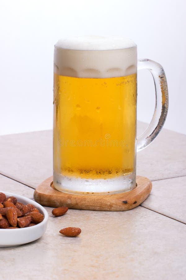 Mug of beer and nuts stock image. Image of refreshment 2757551