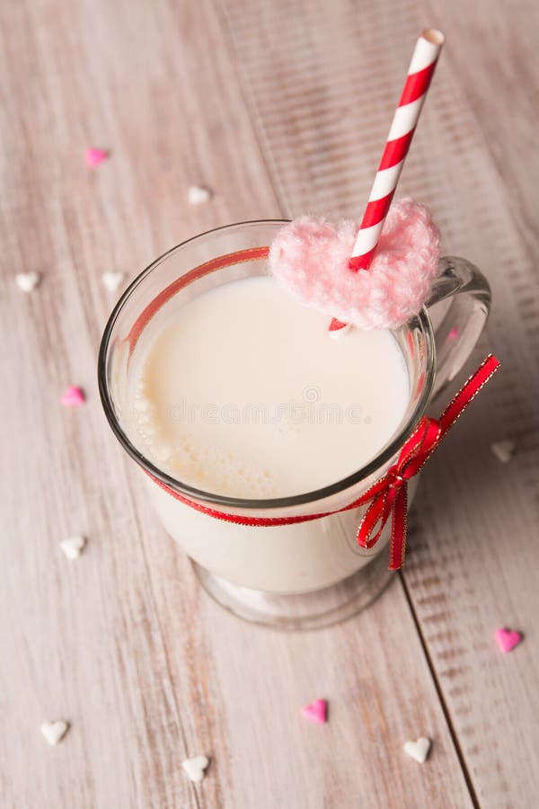 Mug of milk and hearts for Valentines Day stock image Mug of milk and hearts for Valentines Day stock image