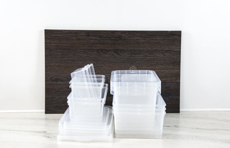 Lot of empty clear plastic storage boxes stacked. Ready for home organizing sorting concept. Plastic container boxes stacked. Lot of empty clear plastic storage boxes stacked. Ready for home organizing sorting concept. Plastic container boxes stacked.