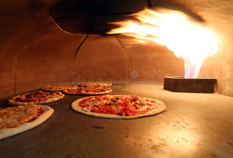 Crispy pizzas in the oven with the hot flame. Crispy pizzas in the oven with the hot flame