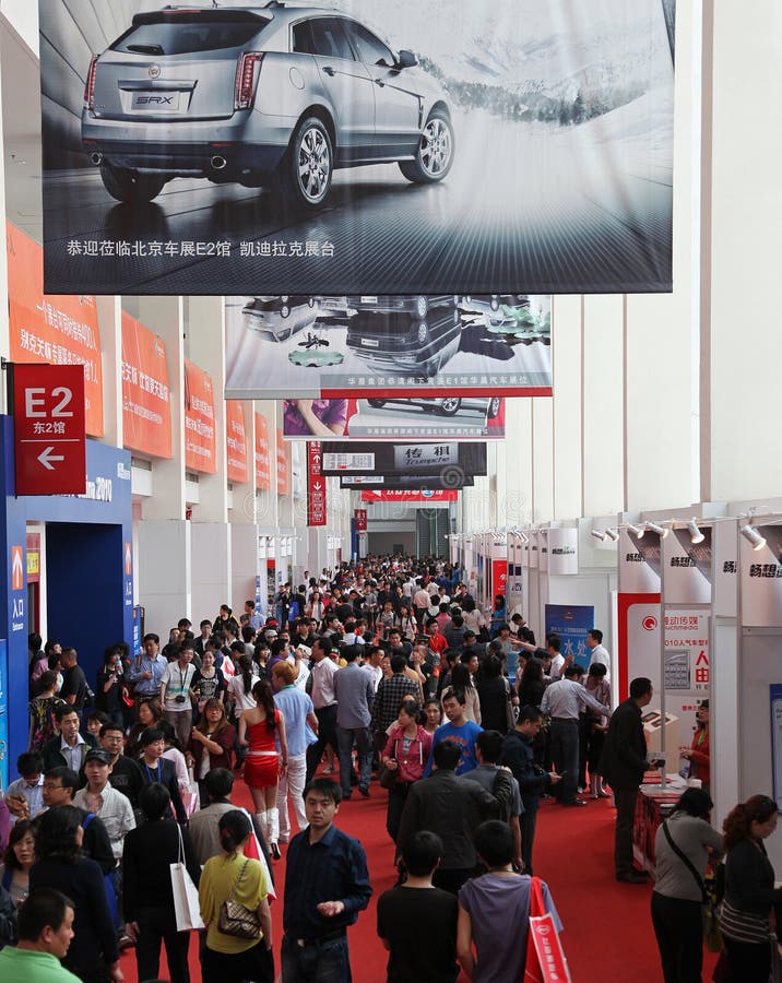 BEIJING - MAY 2: Many Visitors attend the 2010 Beijing International Automotive Exhibition (Auto China 2010) on May 2, 2010 in Beijing, China. This event is one of the most important auto shows in the World. BEIJING - MAY 2: Many Visitors attend the 2010 Beijing International Automotive Exhibition (Auto China 2010) on May 2, 2010 in Beijing, China. This event is one of the most important auto shows in the World.