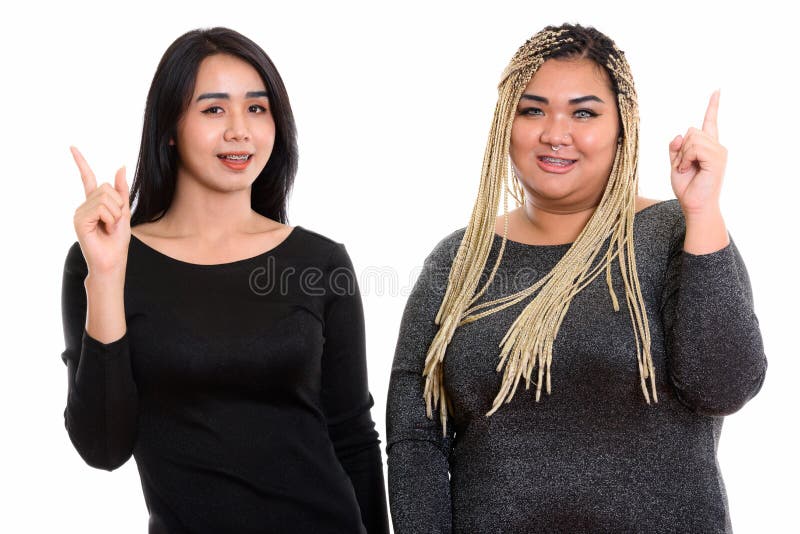 Mujer asiática feliz joven del transexual y sonrisa asiática gorda de la mujer fotos de archivo Mujer asiática feliz joven del transexual y sonrisa asiática gorda de la mujer fotos de archivo