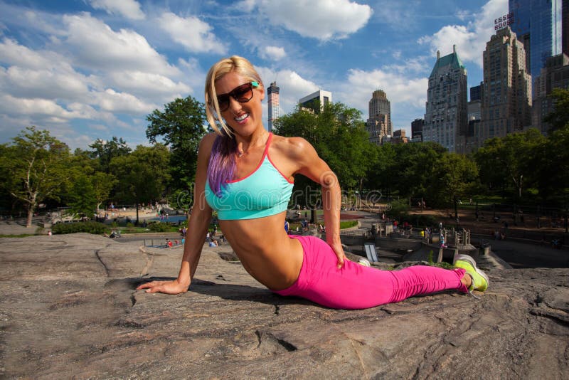 Young Blonde fit Athletic woman exercising in Central Park. Young Blonde fit Athletic woman exercising in Central Park