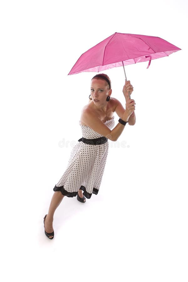 Mujer con el paraguas rosado imagen de archivo libre de regalías Mujer con el paraguas rosado imagen de archivo libre de regalías
