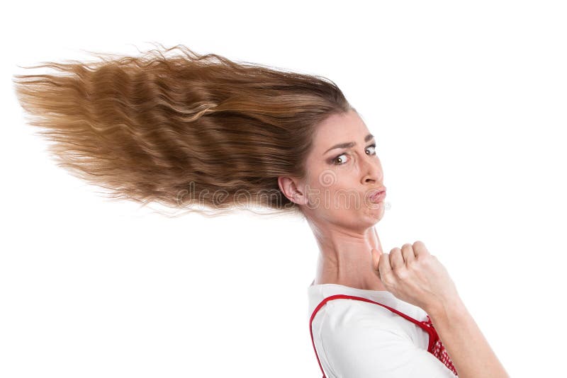 Woman steps on the gas - woman with hurry-blown hair. Woman steps on the gas - woman with hurry-blown hair