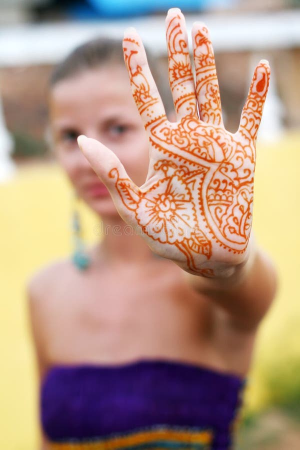 Young beautiful woman with henna tattoo on the palm. Young beautiful woman with henna tattoo on the palm