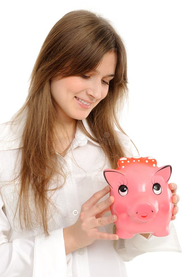 Mujer con un piggybank fotografía de archivo libre de regalías Mujer con un piggybank fotografía de archivo libre de regalías