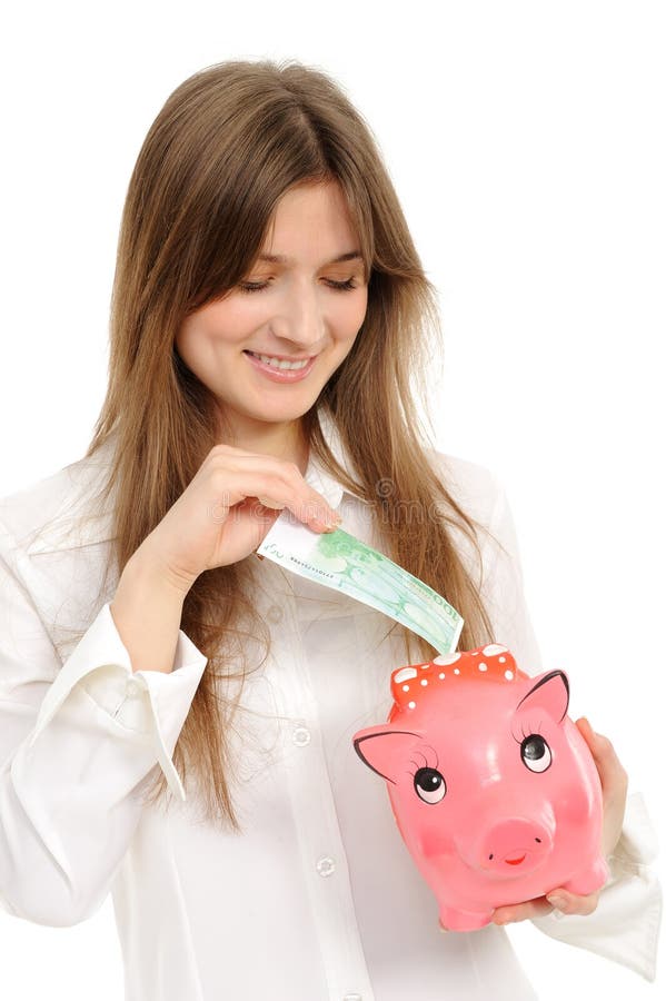 Mujer con un piggybank foto de archivo libre de regalías Mujer con un piggybank foto de archivo libre de regalías