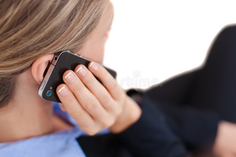 Mujer de negocios acertada que habla en el teléfono fotografía de archivo libre de regalías Mujer de negocios acertada que habla en el teléfono fotografía de archivo libre de regalías