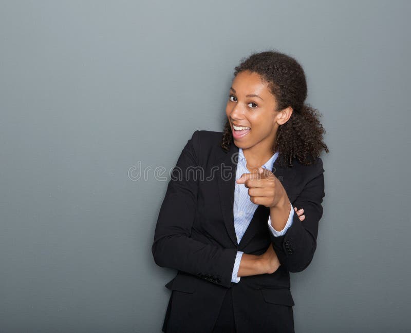 Close up portrait of a happy young business woman pointing finger at you. Close up portrait of a happy young business woman pointing finger at you