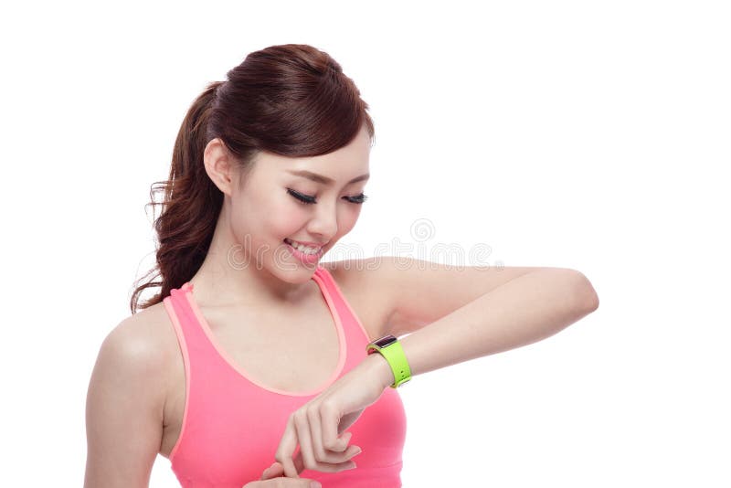 Mujer del deporte que lleva el reloj elegante imagen de archivo Mujer del deporte que lleva el reloj elegante imagen de archivo