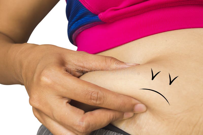 Mujer delgada joven poco gordo en su vientre imagenes de archivo