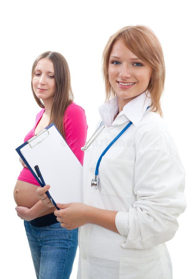 Mujer embarazada y un doctor fotos de archivo libres de regalías Mujer embarazada y un doctor fotos de archivo libres de regalías