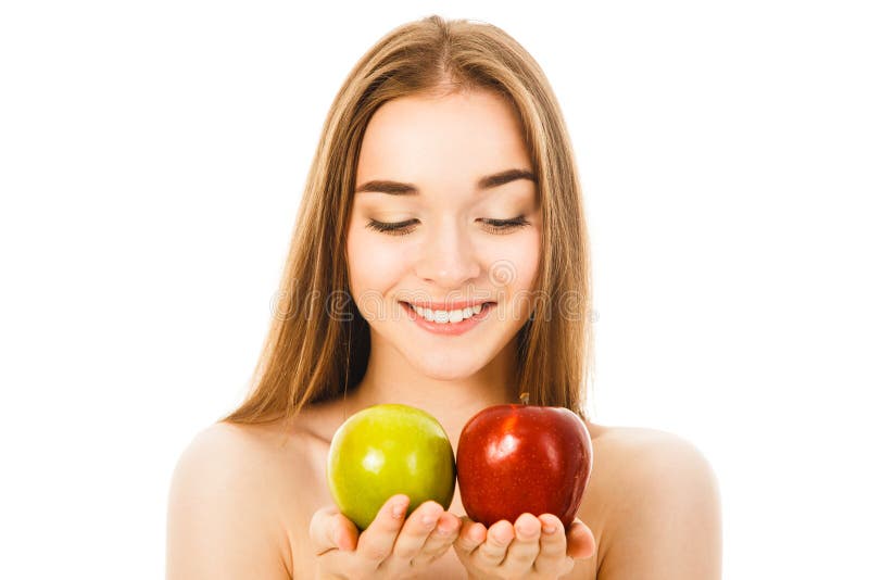 Mujer hermosa con dos manzanas en el fondo blanco foto de archivo libre de regalías Mujer hermosa con dos manzanas en el fondo blanco foto de archivo libre de regalías