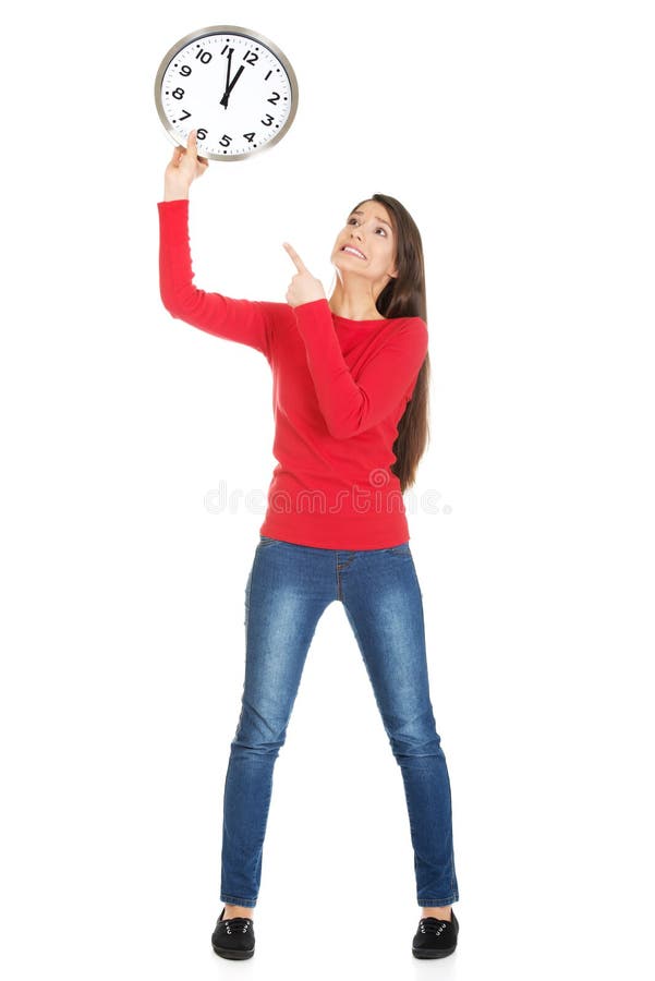 Mujer hermosa con el reloj fotografía de archivo Mujer hermosa con el reloj fotografía de archivo