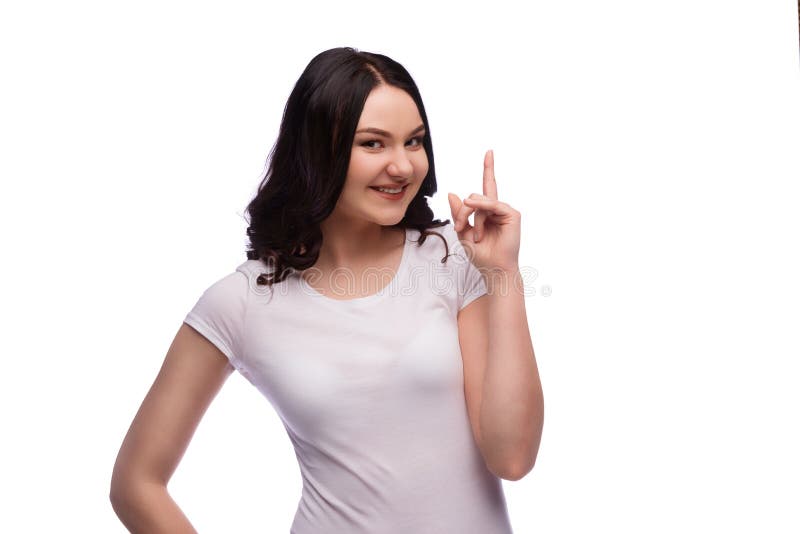 Mujer joven morena que destaca el finger, aislado imagen de archivo Mujer joven morena que destaca el finger, aislado imagen de archivo