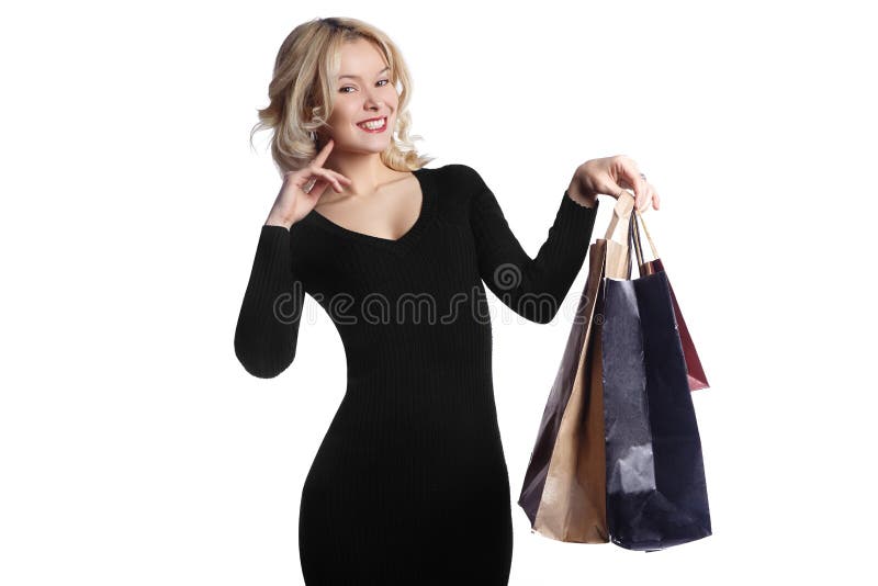 Mujer joven que hace compras que sostiene bolsos aislados en el fondo blanco Moda y ventas Comprador con los bolsos y los regalos fotos de archivo libres de regalías Mujer joven que hace compras que sostiene bolsos aislados en el fondo blanco Moda y ventas Comprador con los bolsos y los regalos fotos de archivo libres de regalías