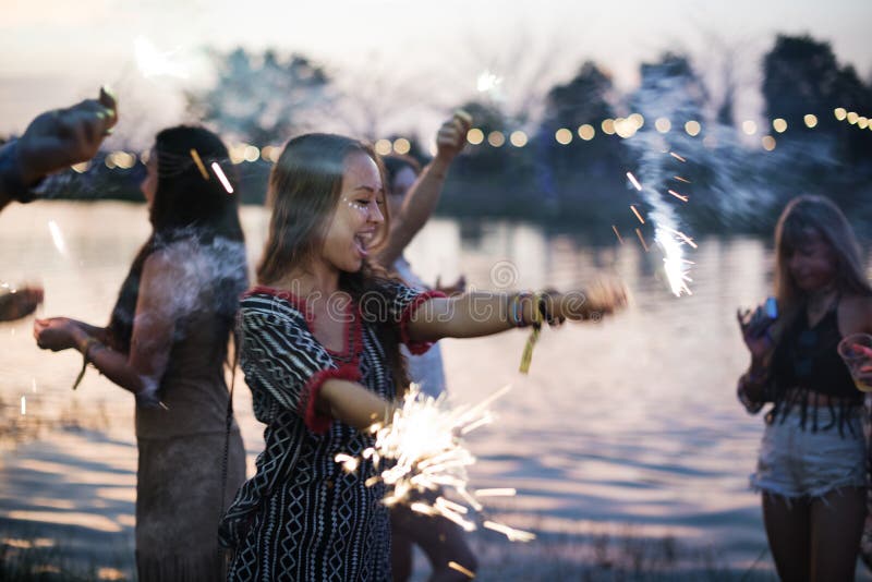 Woman Enjoying Sparkler in Festival Event. Woman Enjoying Sparkler in Festival Event