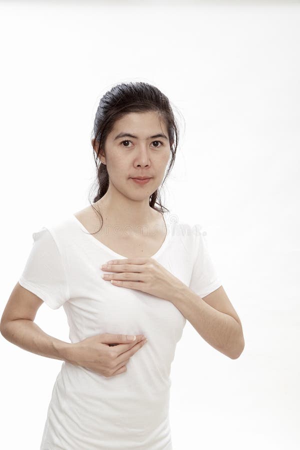 Mujer que se examina para el cáncer de pecho imagenes de archivo Mujer que se examina para el cáncer de pecho imagenes de archivo