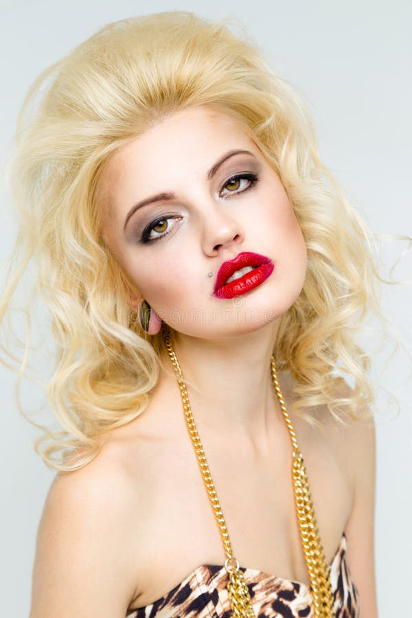 Beautiful young woman with makeup and red lips . Glamour style. Sensual Posing. Beautiful young woman with makeup and red lips . Glamour style. Sensual Posing