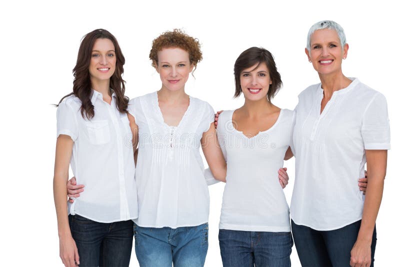 Mujeres alegres que presentan con los tops blancos imagenes de archivo Mujeres alegres que presentan con los tops blancos imagenes de archivo