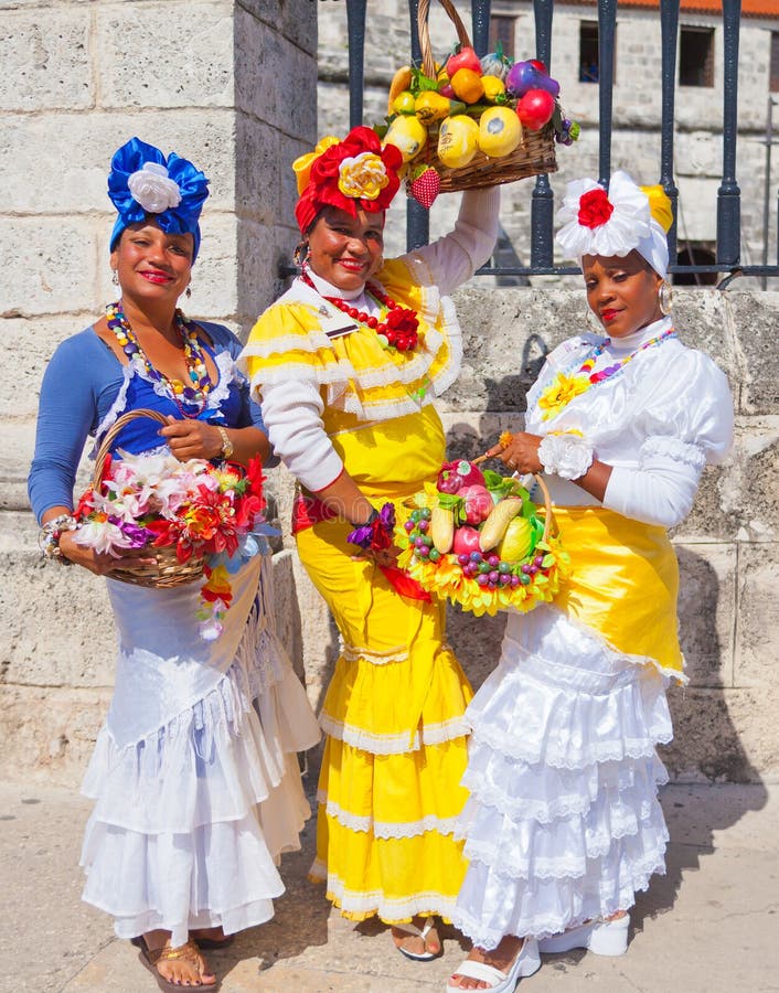 Havana February 2012 These are the traditional clothes worn by these Cuban women to let tourists know the traditions of the island of Cuba. Havana February 2012 These are the traditional clothes worn by these Cuban women to let tourists know the traditions of the island of Cuba.