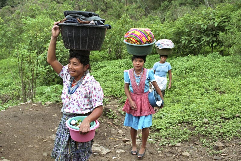 Guatemala, Jalapa Department, village San Pedro Pinula: In the mountains, anther Indians, indigenous people, poverty is enormous, and they have no flowing water in their house. These three generations of Poqoman ethnic women, old and young, should therefore go to a collective laundry room to wash clothes. After this work, they walk together with the laundry in the washtubs on their heads by nature on their way home. Guatemala, Jalapa Department, village San Pedro Pinula: In the mountains, anther Indians, indigenous people, poverty is enormous, and they have no flowing water in their house. These three generations of Poqoman ethnic women, old and young, should therefore go to a collective laundry room to wash clothes. After this work, they walk together with the laundry in the washtubs on their heads by nature on their way home.