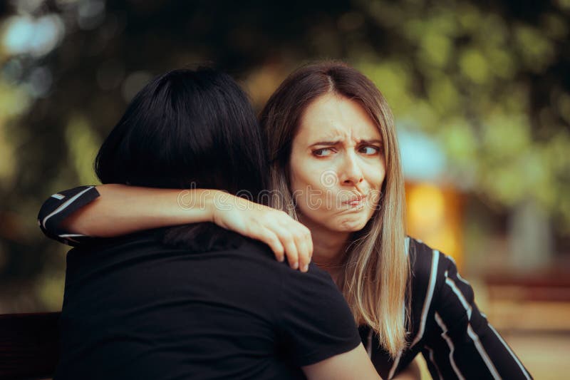 Backstabbing toxic girlfriend embracing someone with bad intentions. Backstabbing toxic girlfriend embracing someone with bad intentions