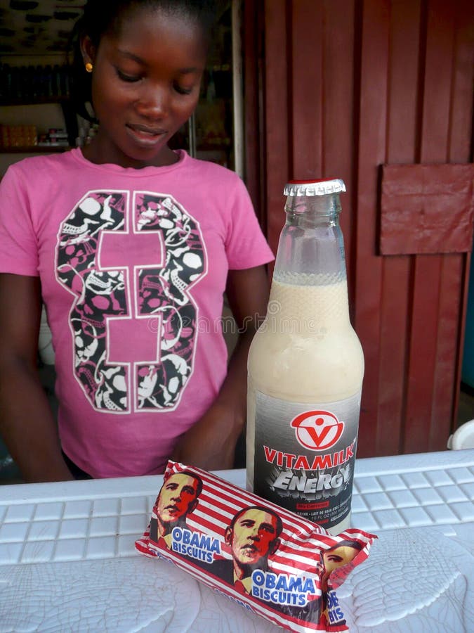 An African woman sells a package of Obama biscuits, along with a bottle of soymilk, from a roadside stand in Accra, Ghana. An African woman sells a package of Obama biscuits, along with a bottle of soymilk, from a roadside stand in Accra, Ghana.