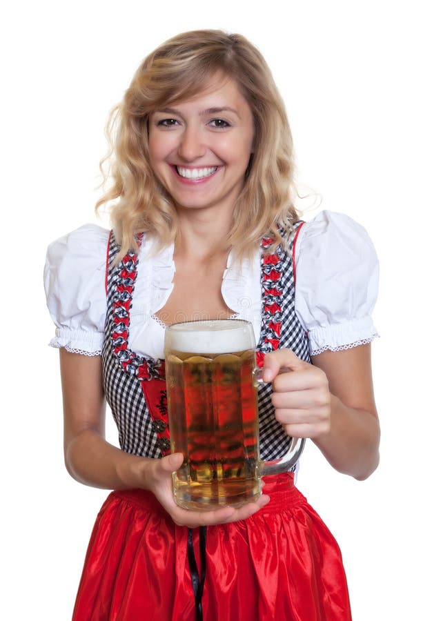 Mulher alemão em um dirndl bávaro tradicional com vidro de cerveja imagens de stock royalty free Mulher alemão em um dirndl bávaro tradicional com vidro de cerveja imagens de stock royalty free