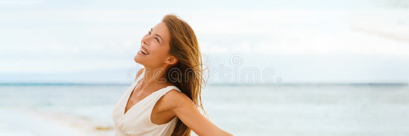 Happy Asian woman feeling good and free on ocean banner background on beach travel vacation cruise panorama. Happy Asian woman feeling good and free on ocean banner background on beach travel vacation cruise panorama